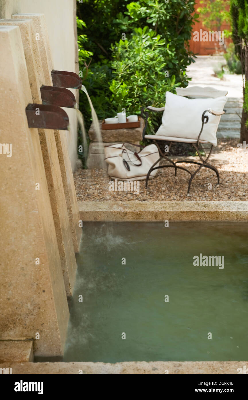 Water feature designed by Steve Williams in the front garden of a Provençal house Stock Photo