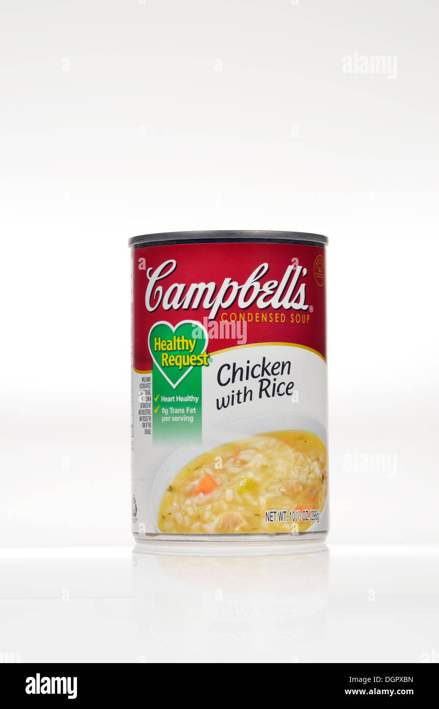 Unopened tin of Campbell's Healthy Request chicken with rice soup on white background, isolated. Stock Photo