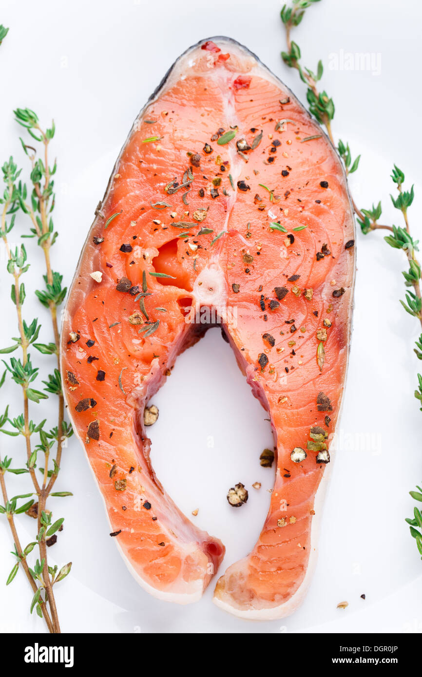 Salmon steak with thyme and pepper Stock Photo Alamy