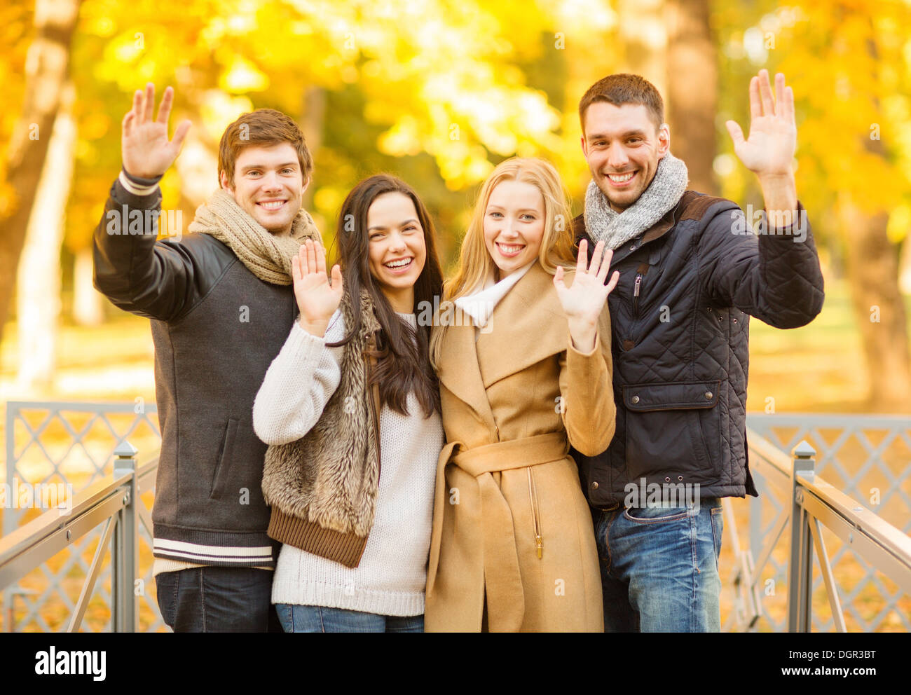 group of friends having fun in autumn park Stock Photo - Alamy
