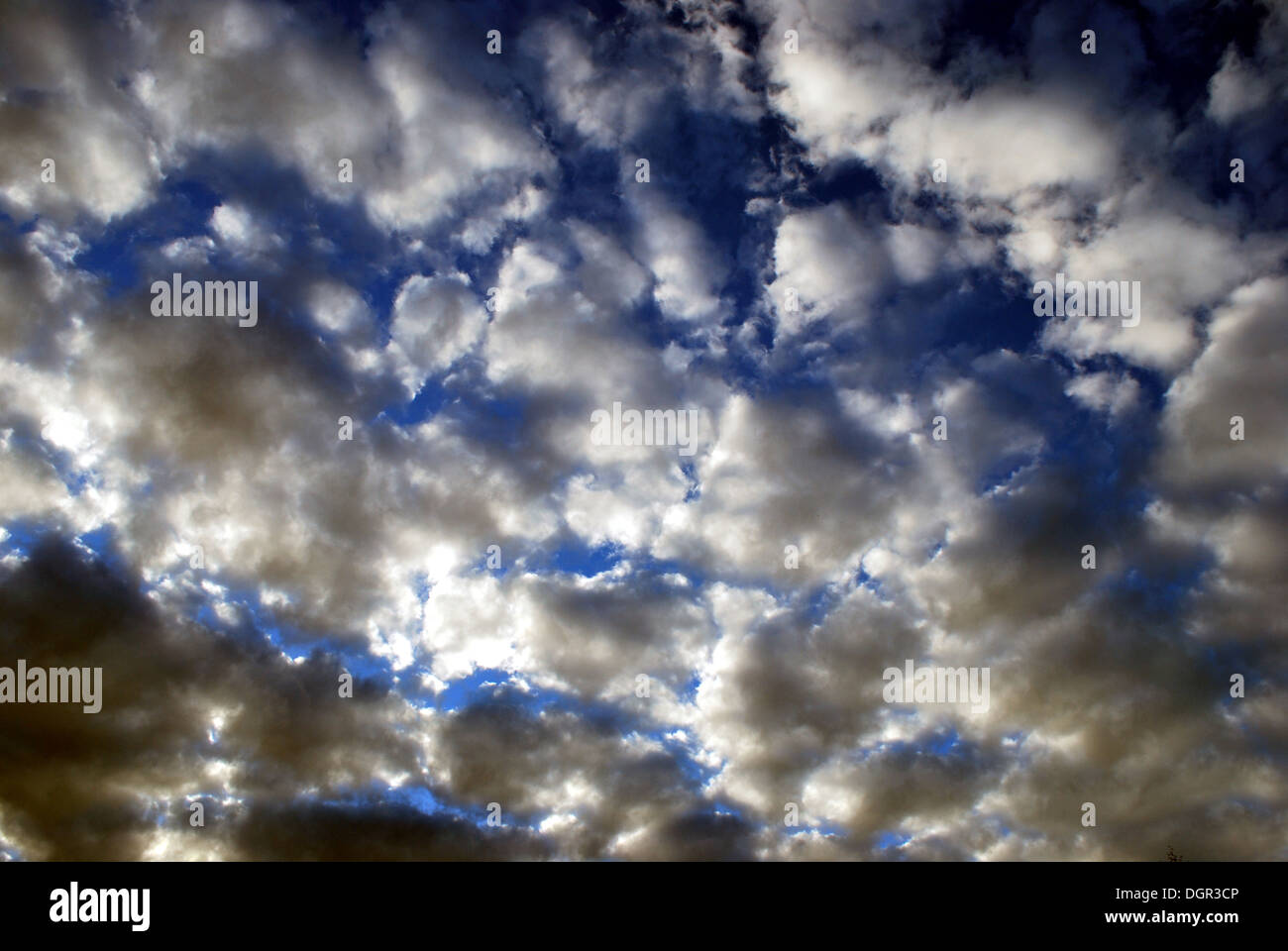 Stormy clouds on blue sky contrasting Stock Photo