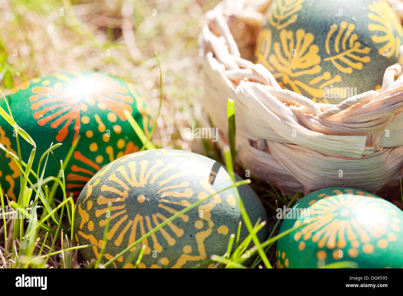 easter eggs decorated with bee wax on the grass Stock Photo