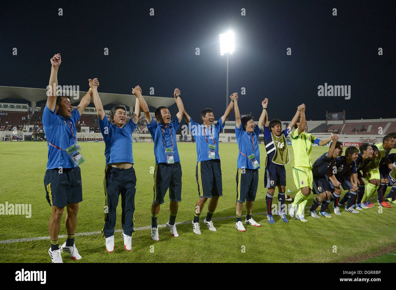 Sharjah, United Arab Emirates. 24th Oct, 2013. Japan team group (JPN) Football / Soccer : Players and staffs of Japan celebrate their upset winning after the FIFA U-17 World Cup UAE 2013 Group D match between Japan 2-1 Tunisia at Sharjah Stadium in Sharjah, United Arab Emirates . © FAR EAST PRESS/AFLO/Alamy Live News Stock Photo