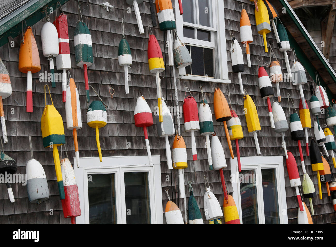 Lobster pot buoys on an old wharf building, Bass Harbor, Maine Stock