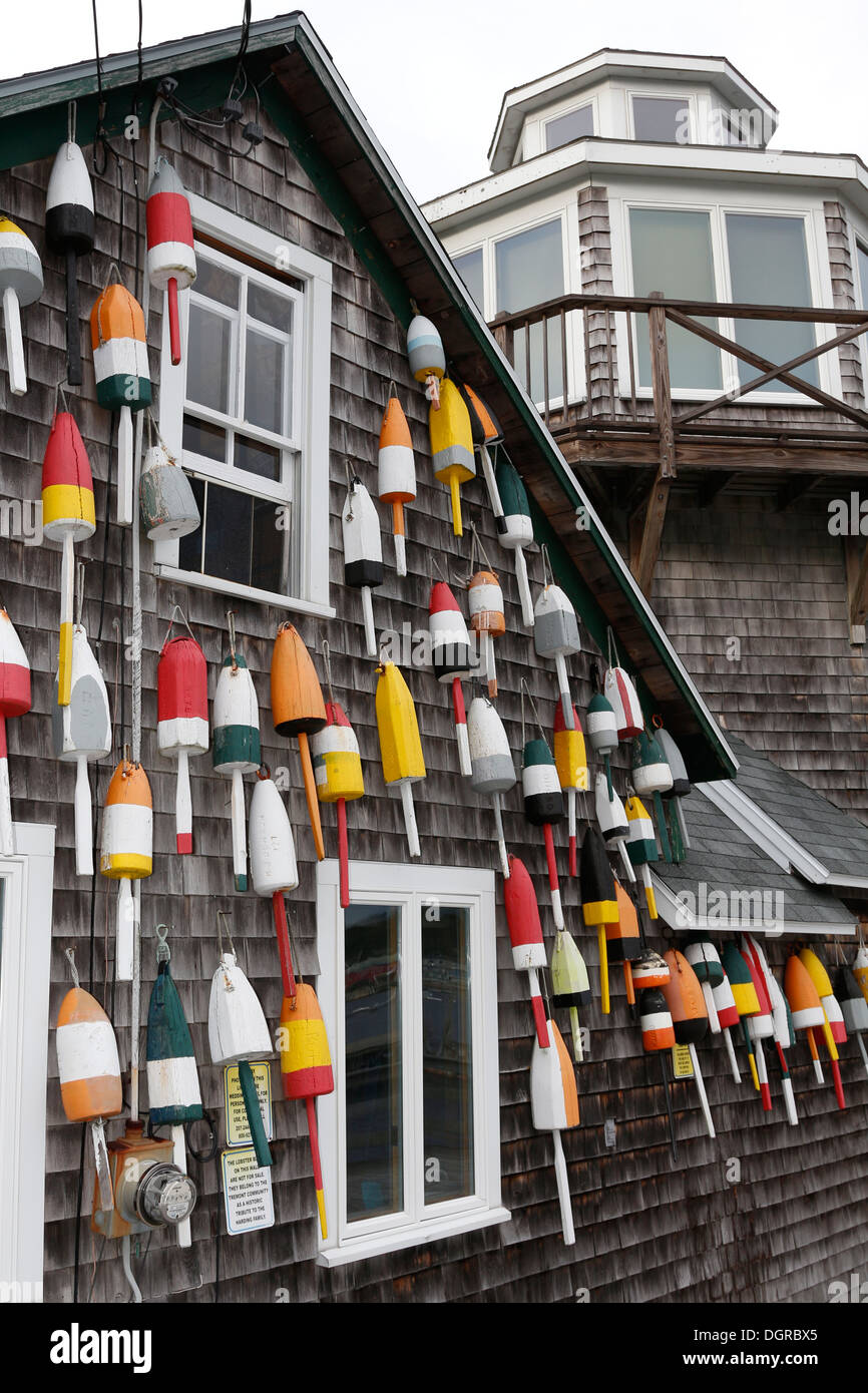 Lobster pot buoys on an old wharf building, Bass Harbor, Maine Stock Photo