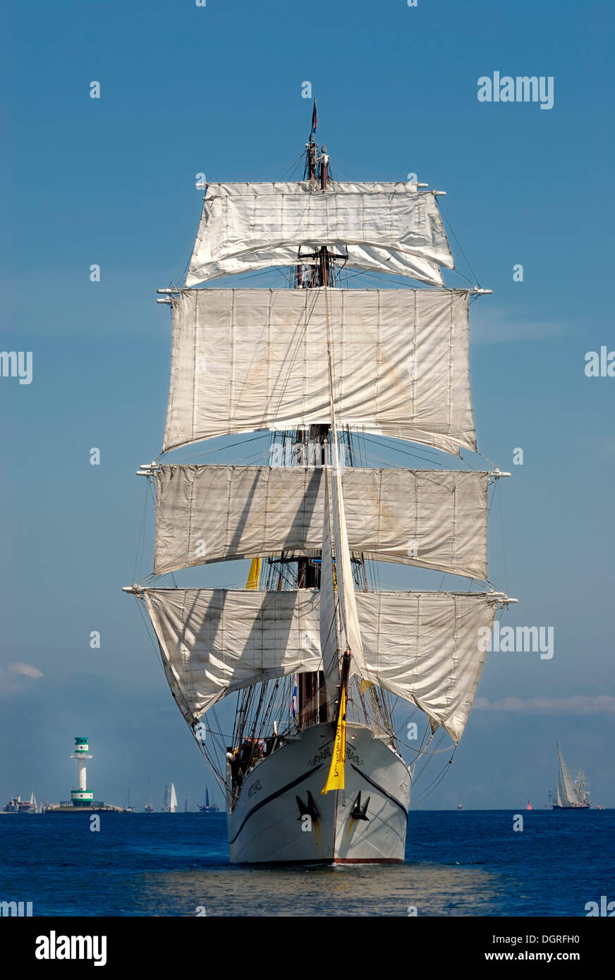 Fully rigged three-masted barque, traditional sailing, windjammer Arthemis with the Friedrichsort lighthouse in the distance Stock Photo