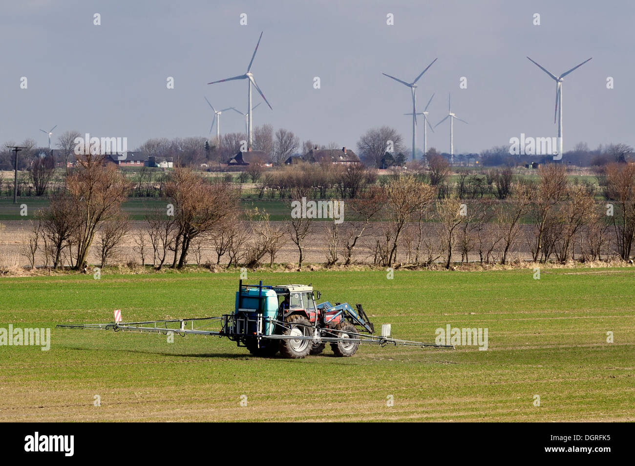 Intensive farming, farmer spraying pesticide, North Frisian marsh, North Friesland, Schleswig-Holstein Stock Photo