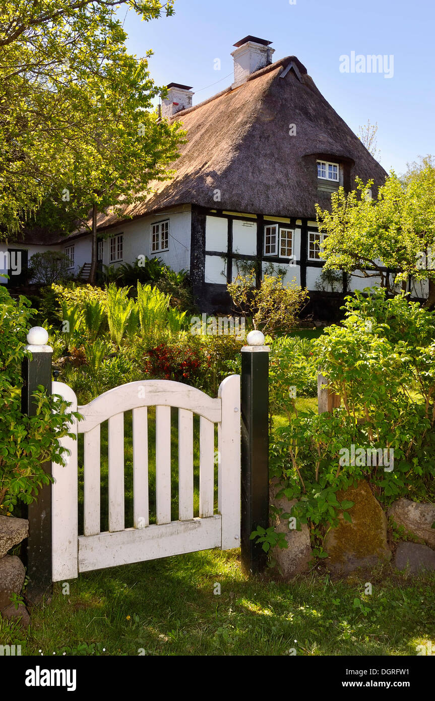 Half-timbered house behind a garden gate, Sieseby on the Schlei river, Thumby, Rendsburg-Eckernfoerde district Stock Photo