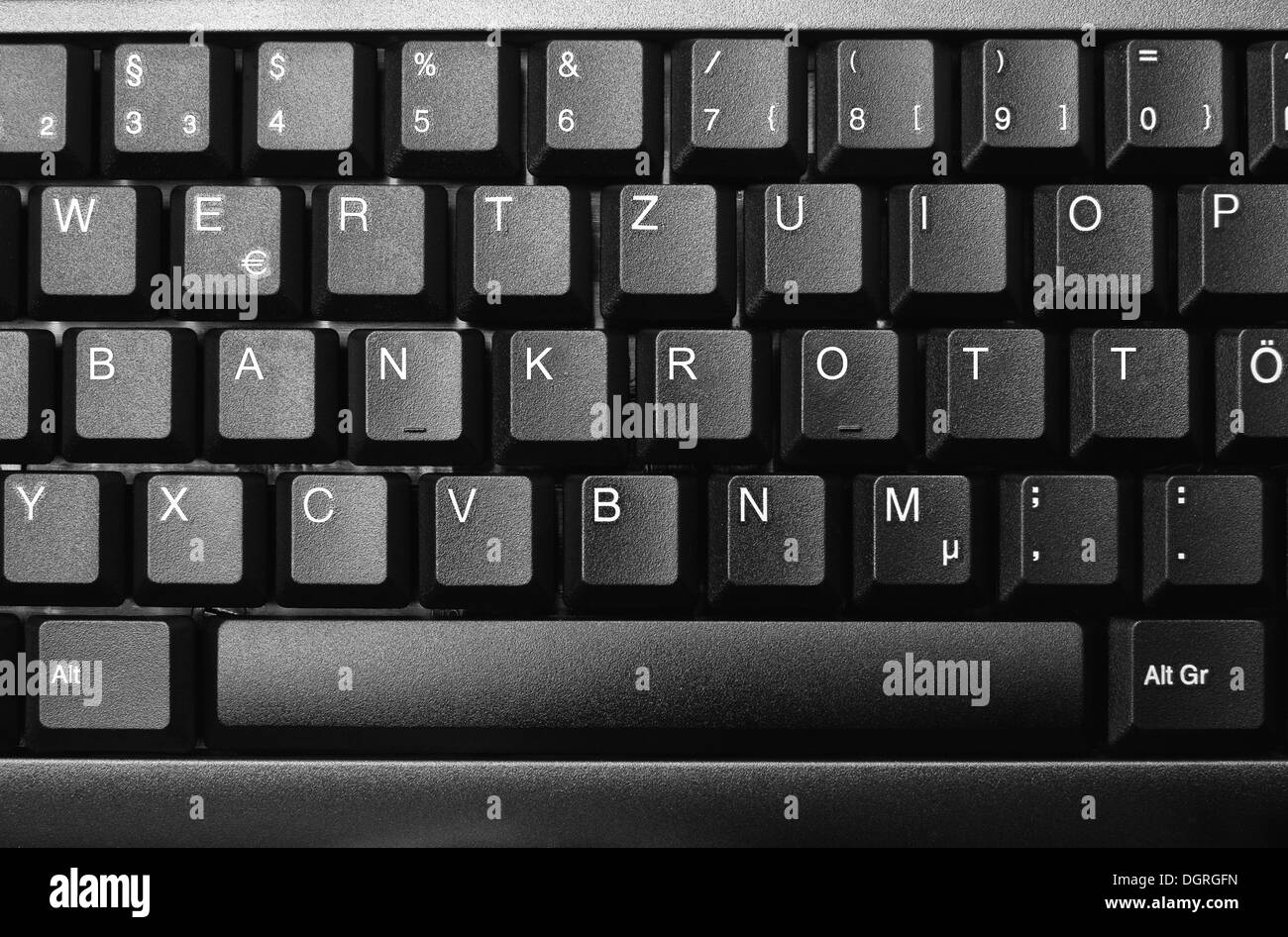 Keyboard with word 'Bankrott', bankruptcy in white Stock Photo