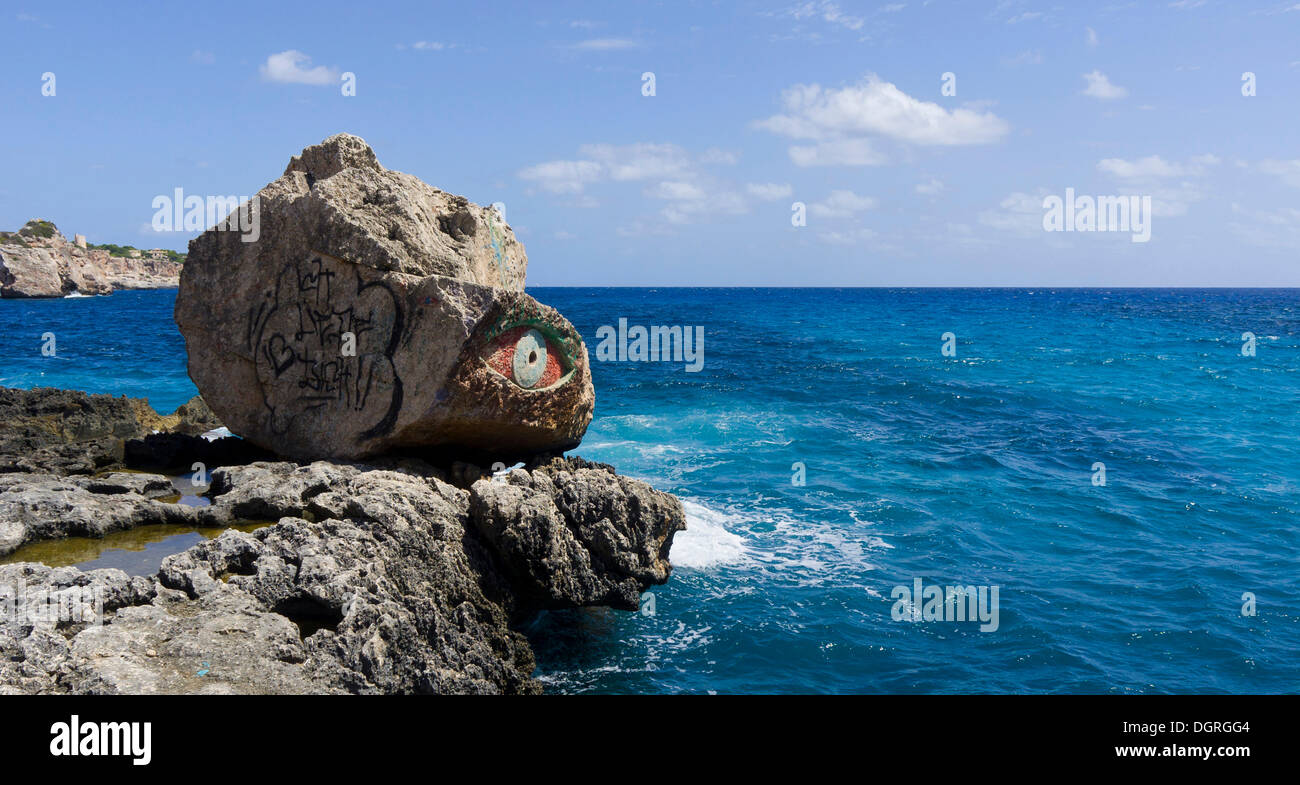 Rock with a painted eye, Cala Llombards, Majorca, Spain, Europe Stock Photo