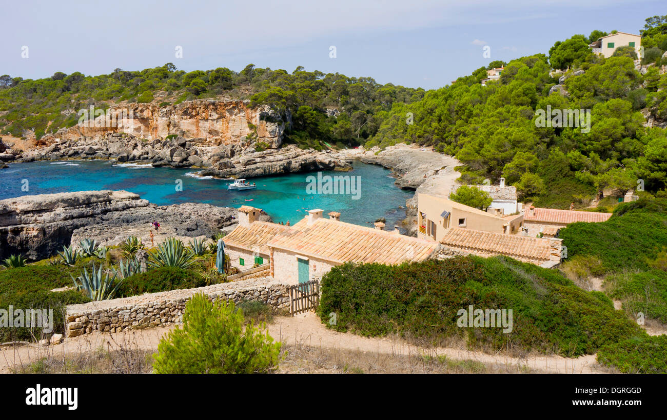 Rocky coastline with fishermen's houses near Cala s'Almunia, Majorca, Spain, Europe Stock Photo