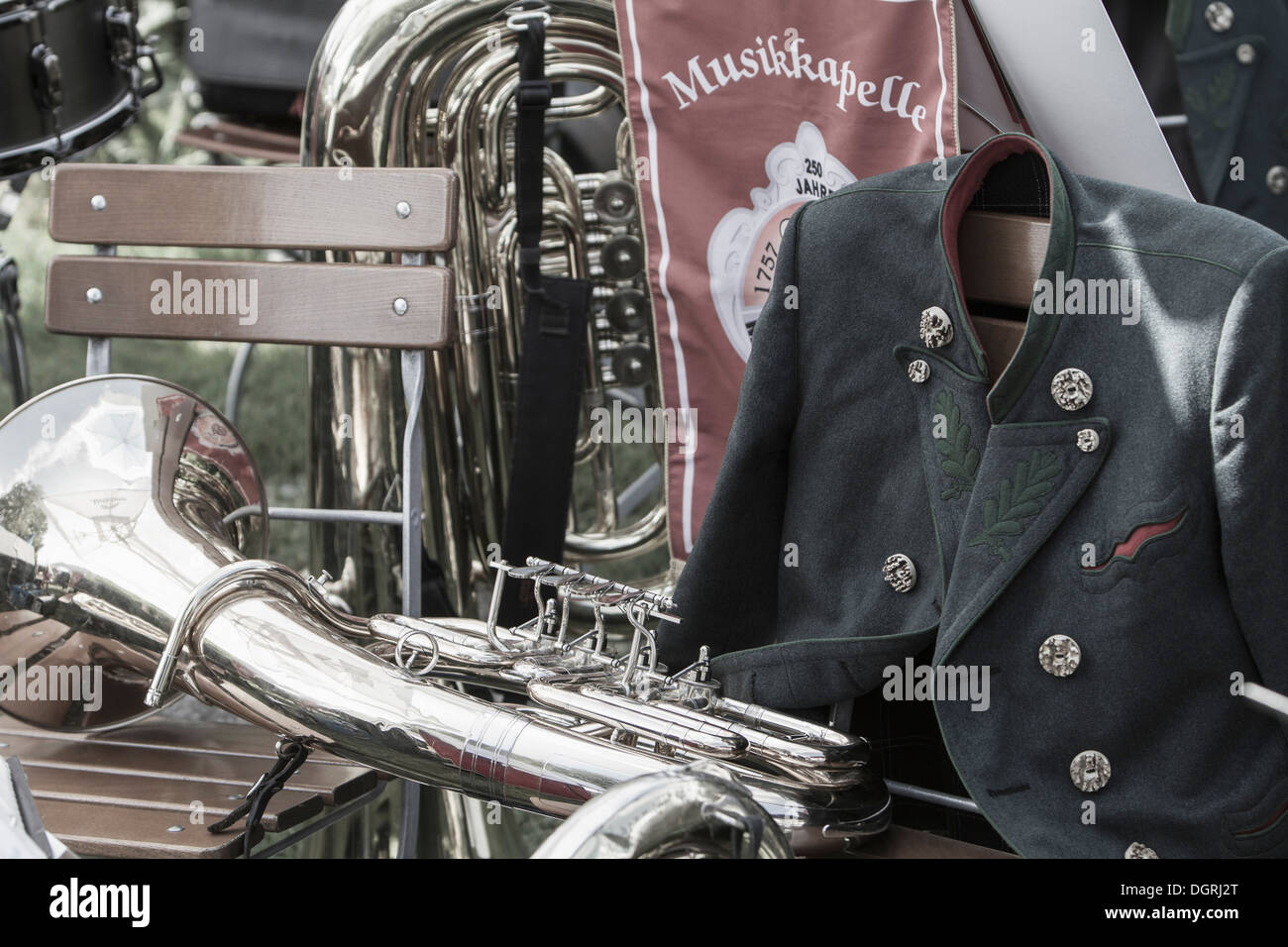 Germany, Bavaria, Chiemgau, Trumpet and tuba on chairs with traditional ...