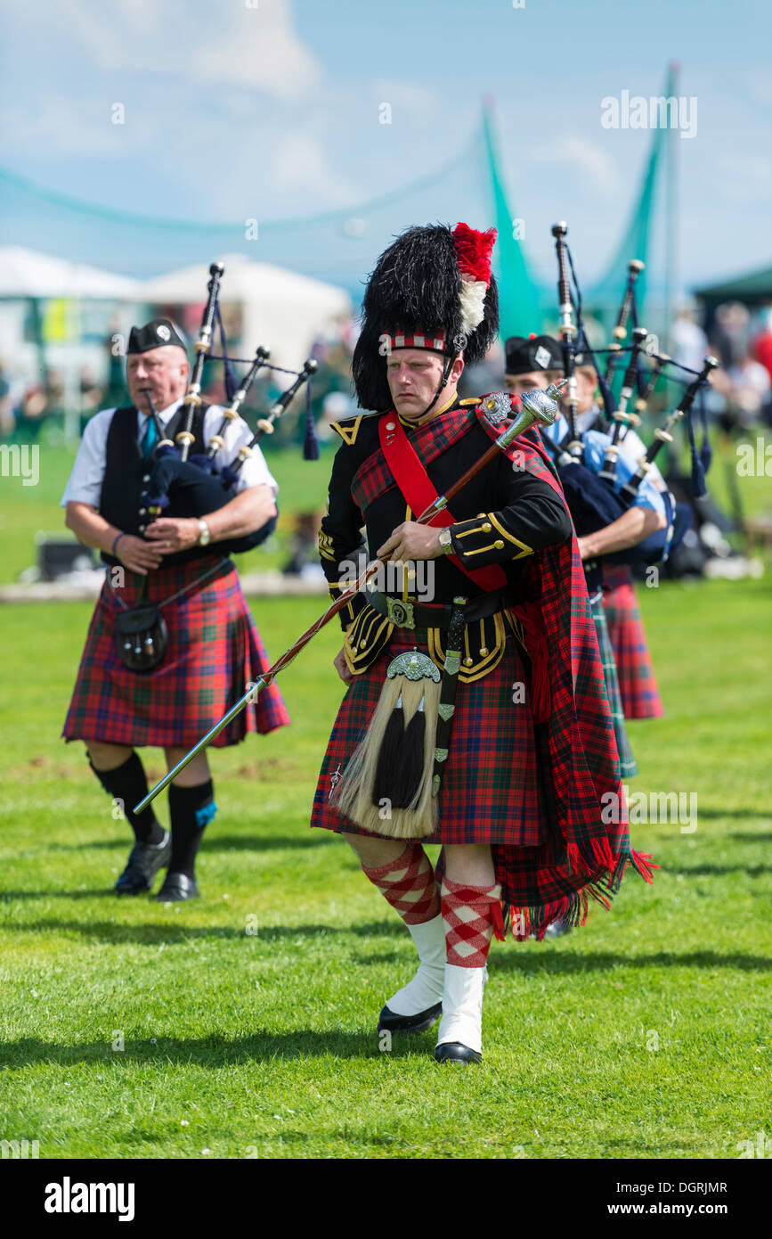 The Drum Major leading the bagpipe parade, Helmsdale Highland Games, Helmsdale, Sutherland, Scotland, United Kingdom, Europe Stock Photo