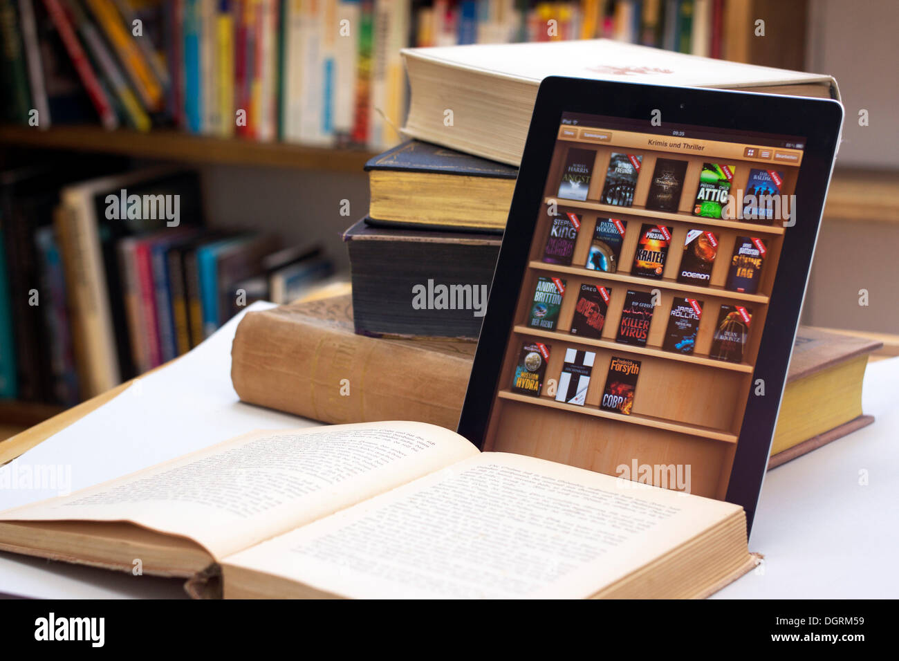 E-book reader beside a stack of old books, Germany Stock Photo