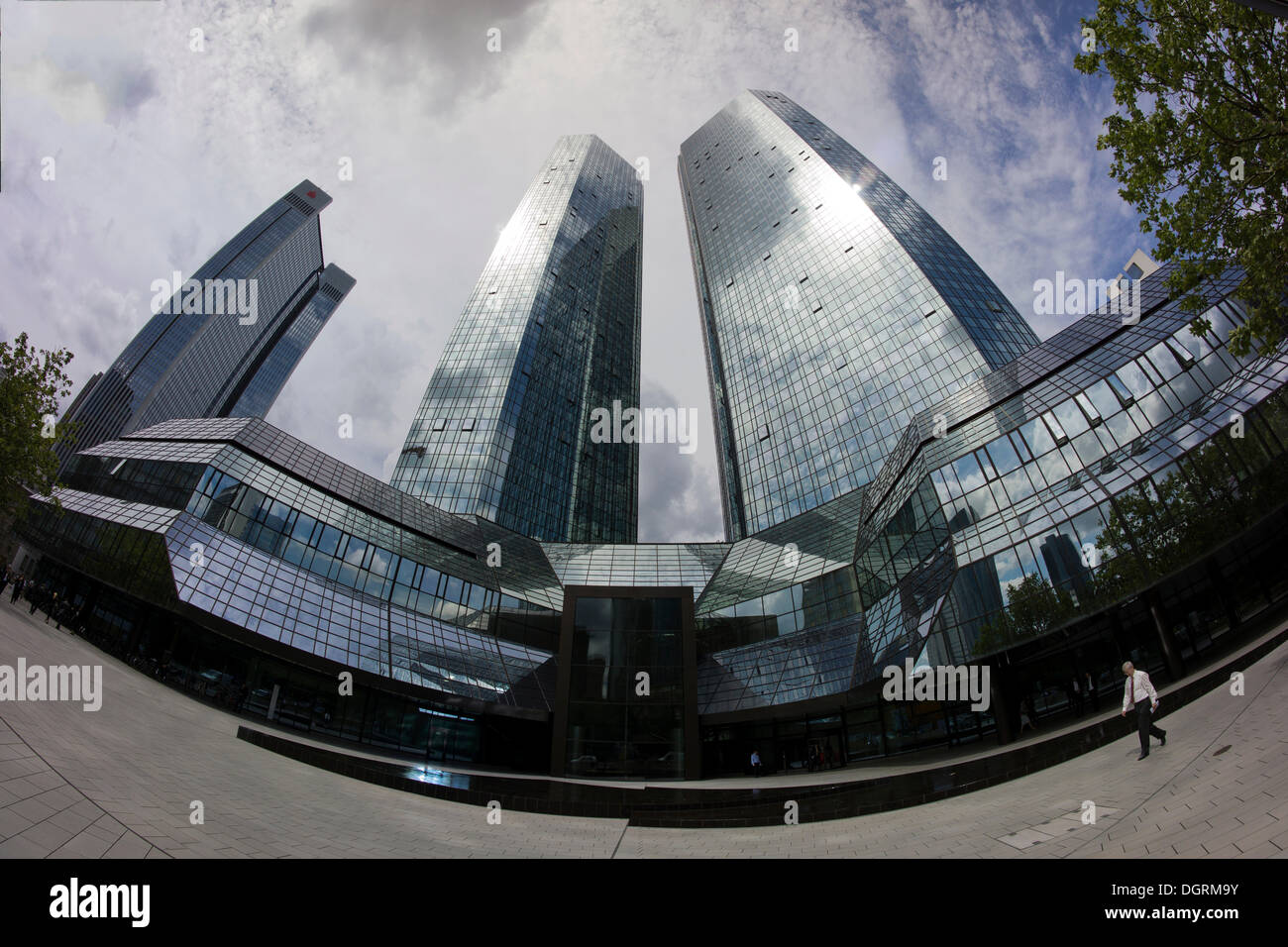 Deutsche Bank headquarters with lonely banker in front of the Deutsche Bank buildings, Frankfurt skyline, Frankfurt am Main Stock Photo
