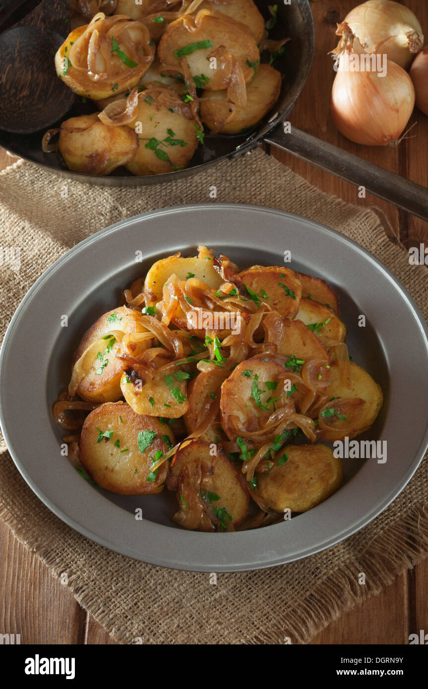 Lyonnaise potatoes. Pommes Lyonnaise. Fried potatoes with onions Stock