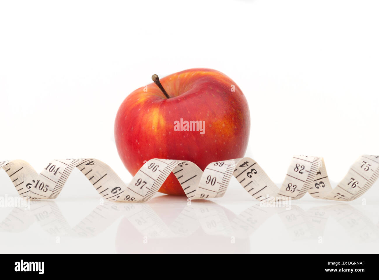 Red apple and measuring tape Stock Photo