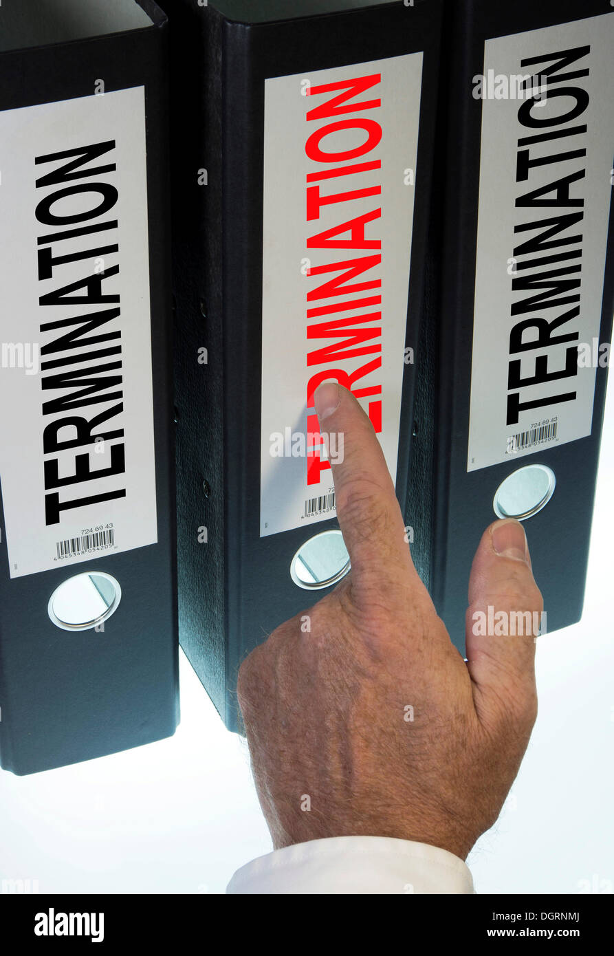 Hand pointing to a file folder labeled 