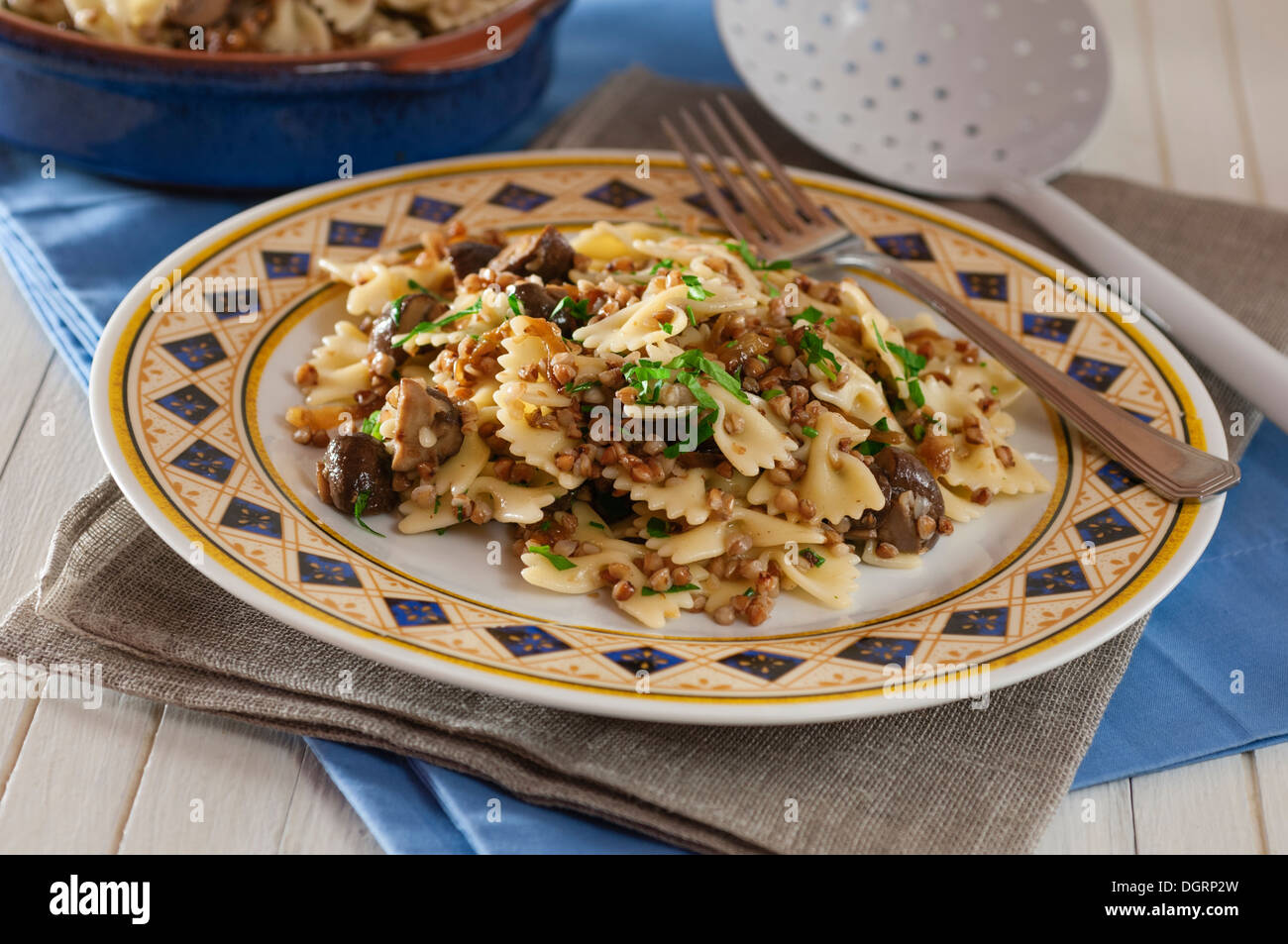 Kasha varnishkes. Buckwheat and pasta dish with mushrooms and onions. Stock Photo