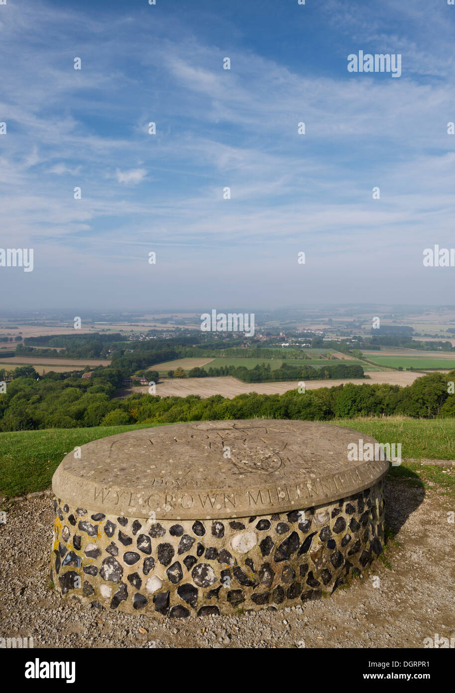 The Wye Crown Millennium Stone overlooking the village of Wye on a sunny morning. Stock Photo