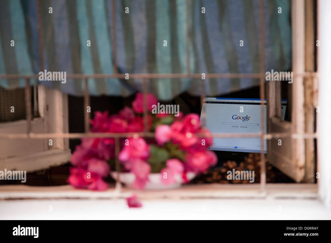 Google Logo on laptop Spied through Window - Sardinia , Italy Stock Photo