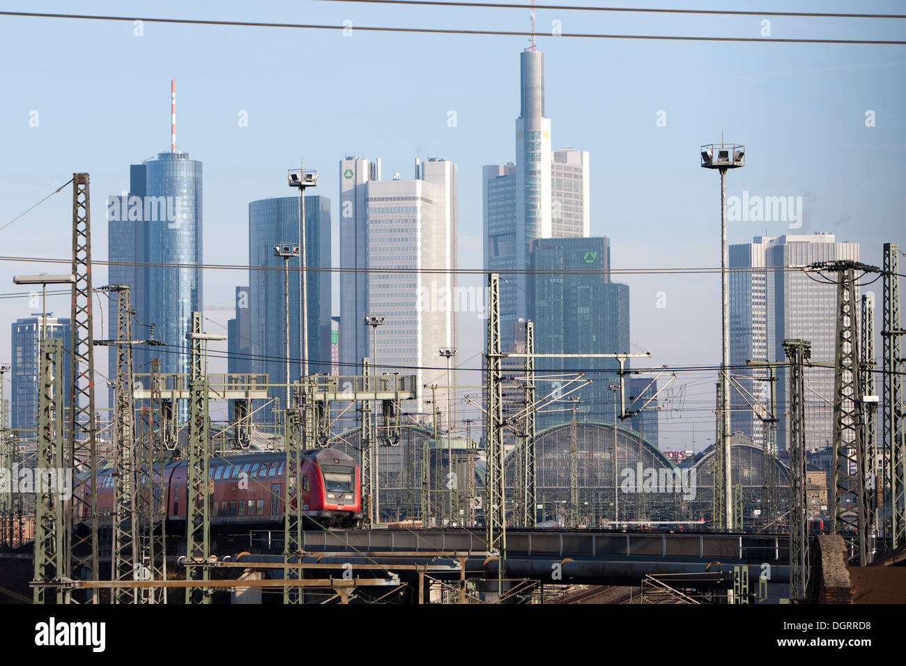 Frankfurt main station with a moving train of the German Federal Railways, Frankfurt skyline at the back, Commerzbank tower Stock Photo