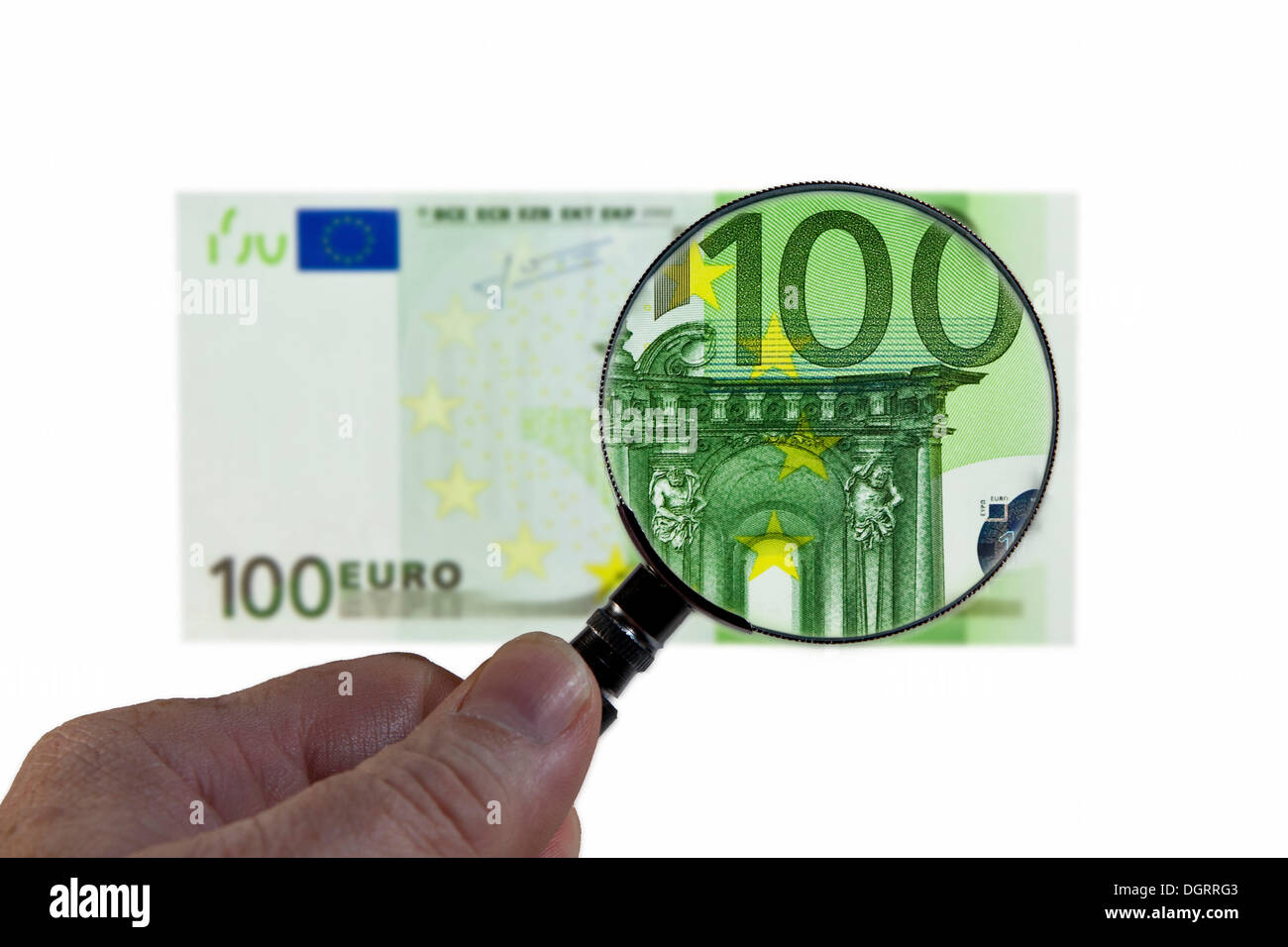 100 euro banknote under a magnifying glass, symbolic image, observation of the euro Stock Photo