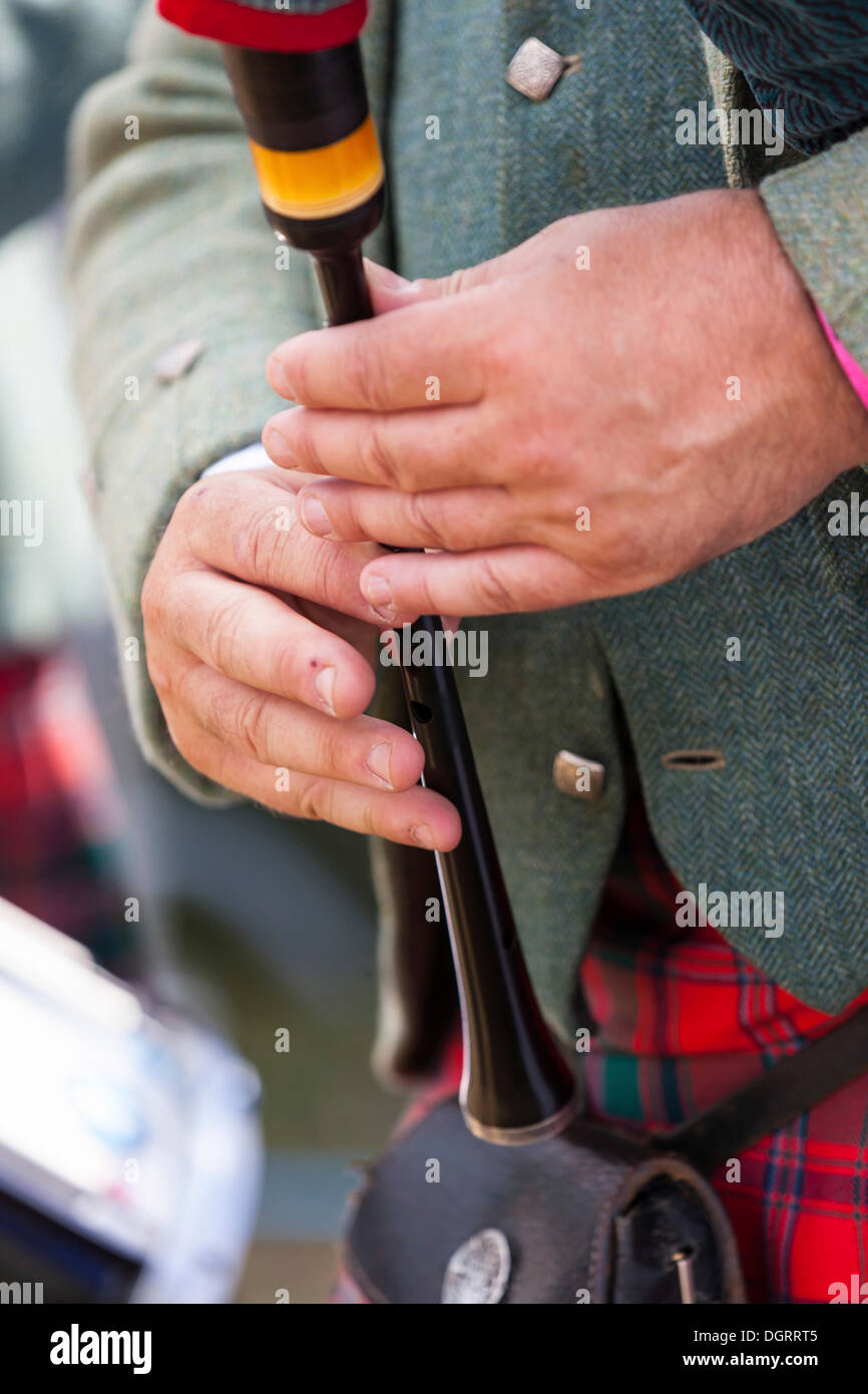 Detail view of the hands of a Scottish piper playing the bagpipes, Hesse Stock Photo