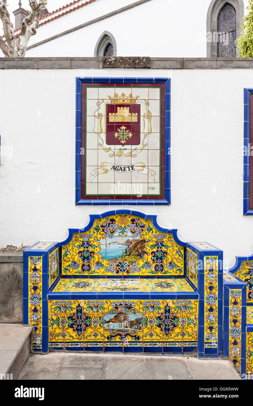 Tiled bench, Promenade Paseo de Canarias, bench with tiles of the 21 communites, images and coat of arms, community of Agate Stock Photo