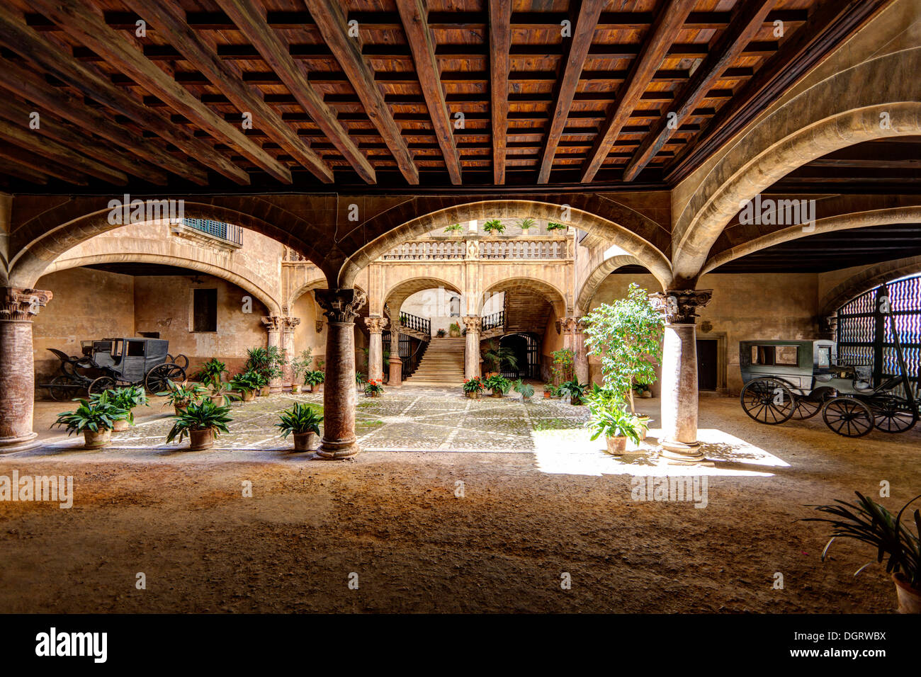 Inner courtyard with old carriages, historic town centre, Palma de Majorca, Majorca, Balearic Islands, Spain, Europe Stock Photo