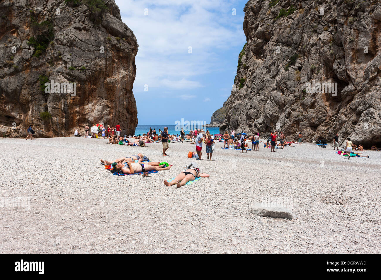 Tourists sunbathing in Torrent de Pareis Gorge, Cala de Sa Calobra Bay ...