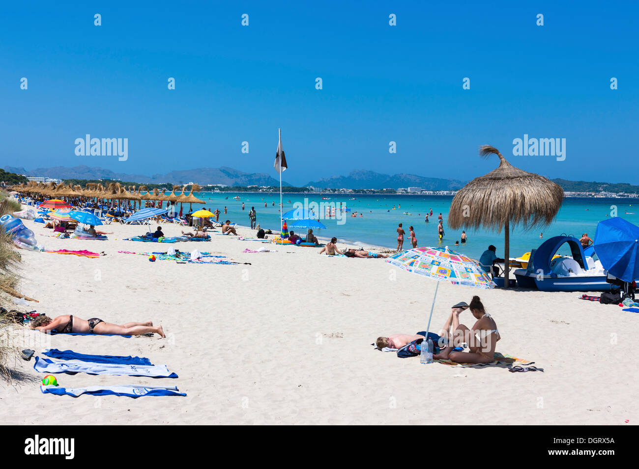 Sandy beach with tourists, Playa de Muro, Bon Aire Ses Fotges, Majorca, Balearic Islands, Spain Stock Photo