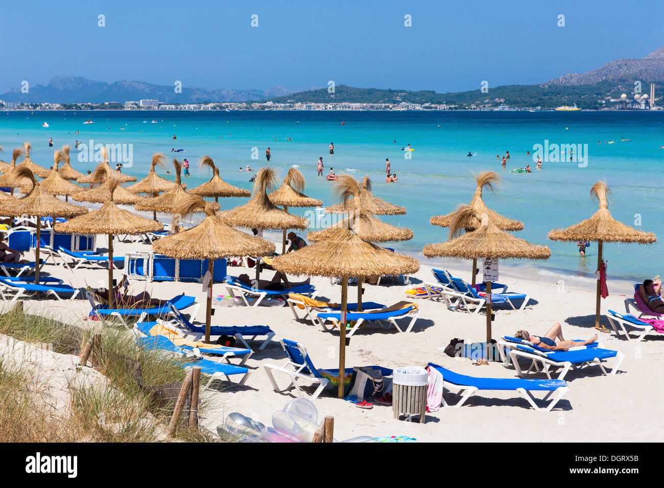 Crowded beach, tourists on a sandy beach, Playa de Muro, Bon Aire Ses Fotges, Majorca, Balearic Islands, Spain Stock Photo