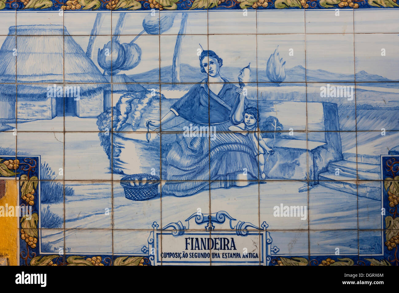Azulejo, mural made of ceramic tiles, woman holding a spindle, in Funchal, Santa Luzia, Funchal, Madeira, Portugal Stock Photo