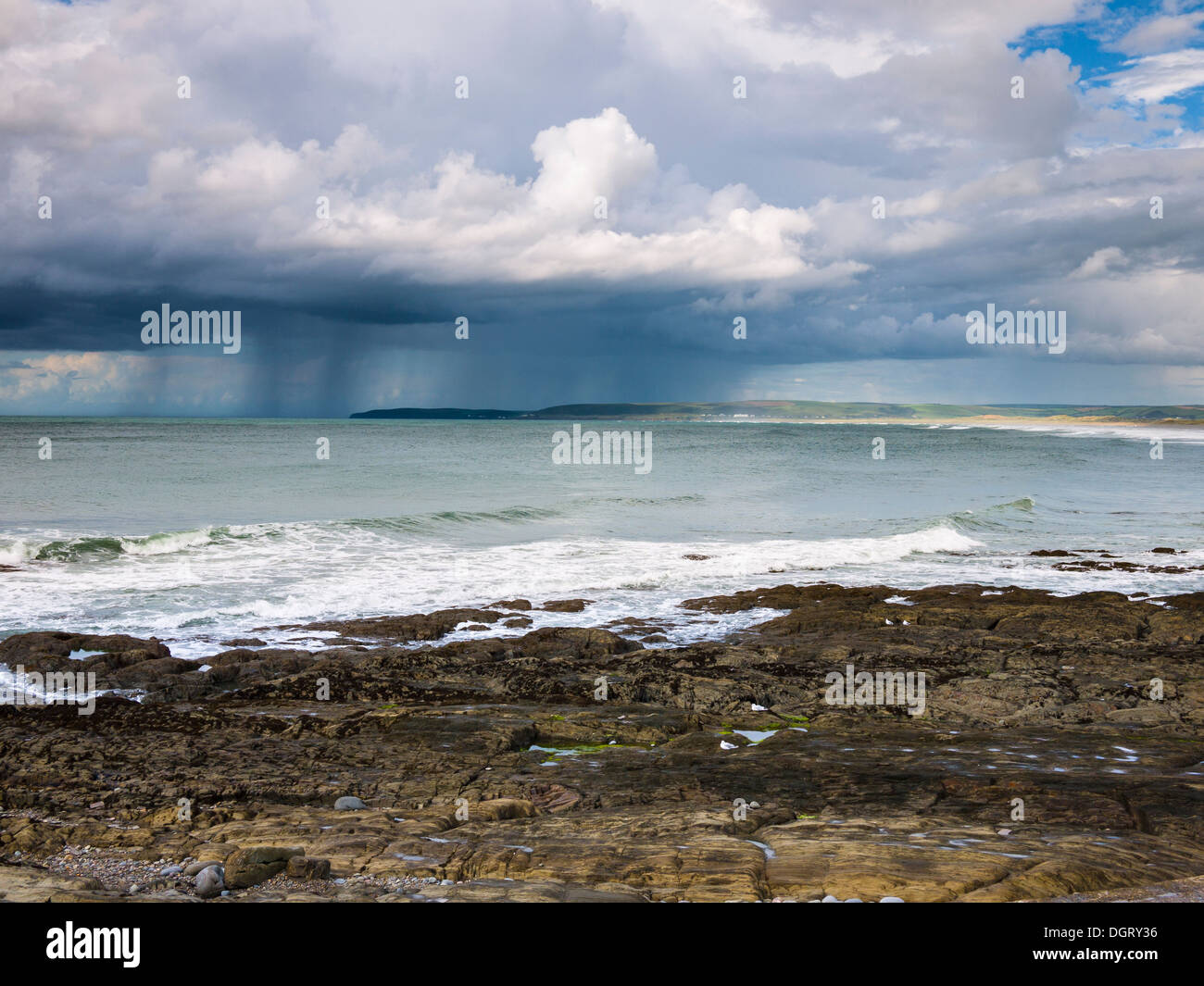 Summer rainstorm over Baggy Point viewed from Westward Ho! beach on the North Devon coast, England. Stock Photo