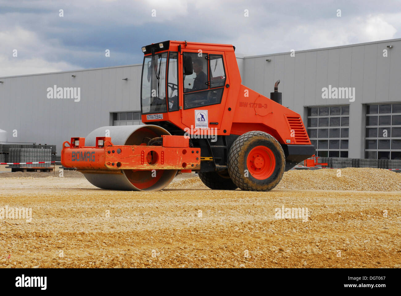 Road roller used on a commercial property in Neutraubling, Bavaria Stock Photo