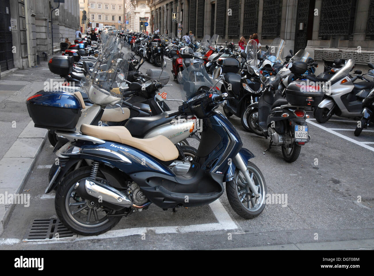 Parking area for motorcycles and motor scooters in the historic district of Trieste, Italy