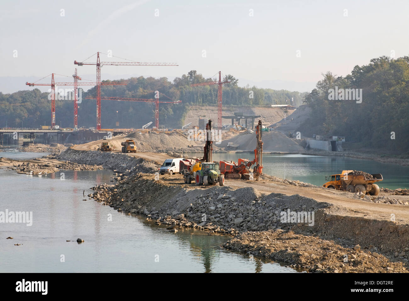 Construction site of the new hydropower plant in Rheinfelden, deepening of the lower water with a temporary filled dam in the Stock Photo