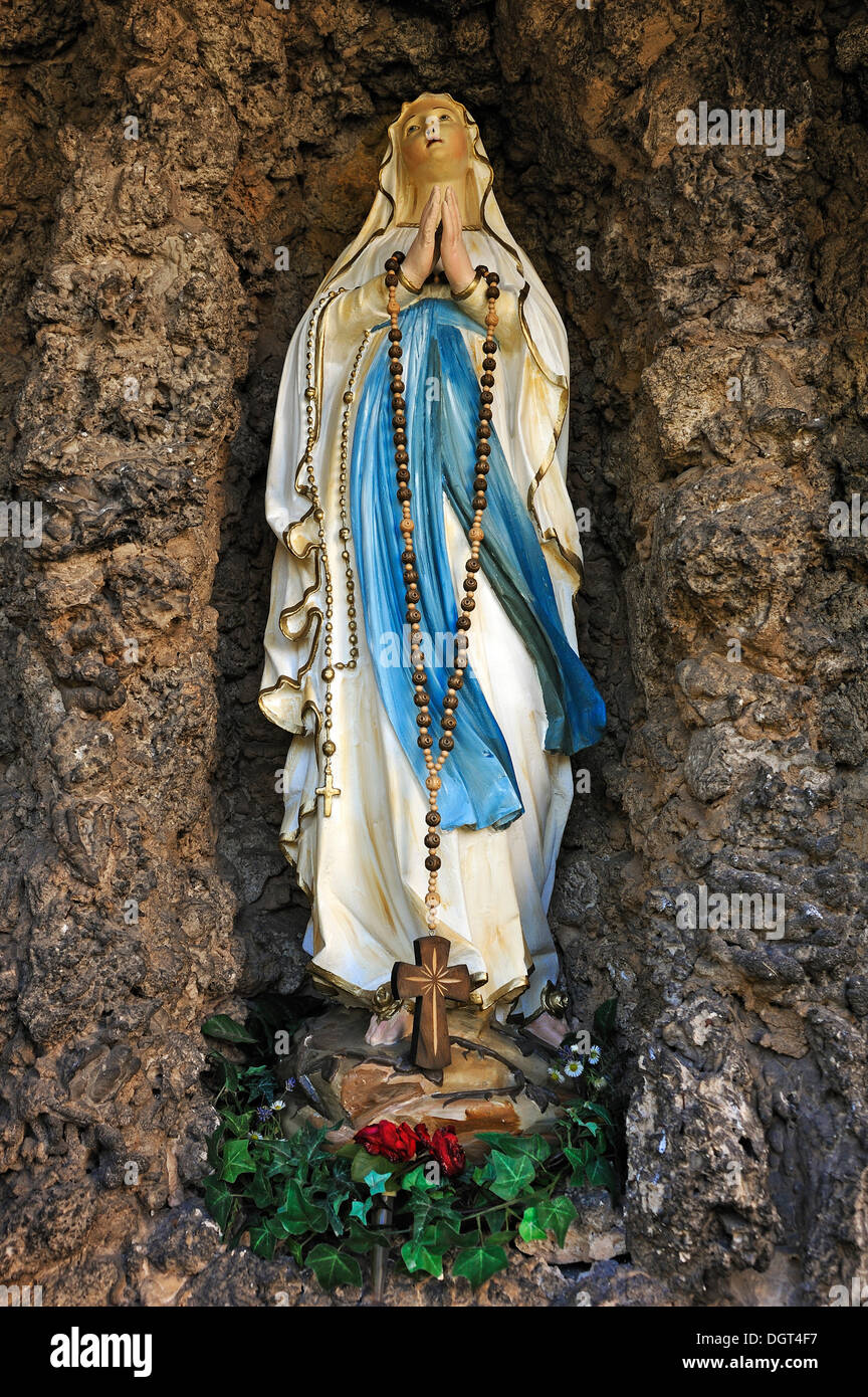 Statue of the Virgin Mary in a grotto at the Parish Church of St