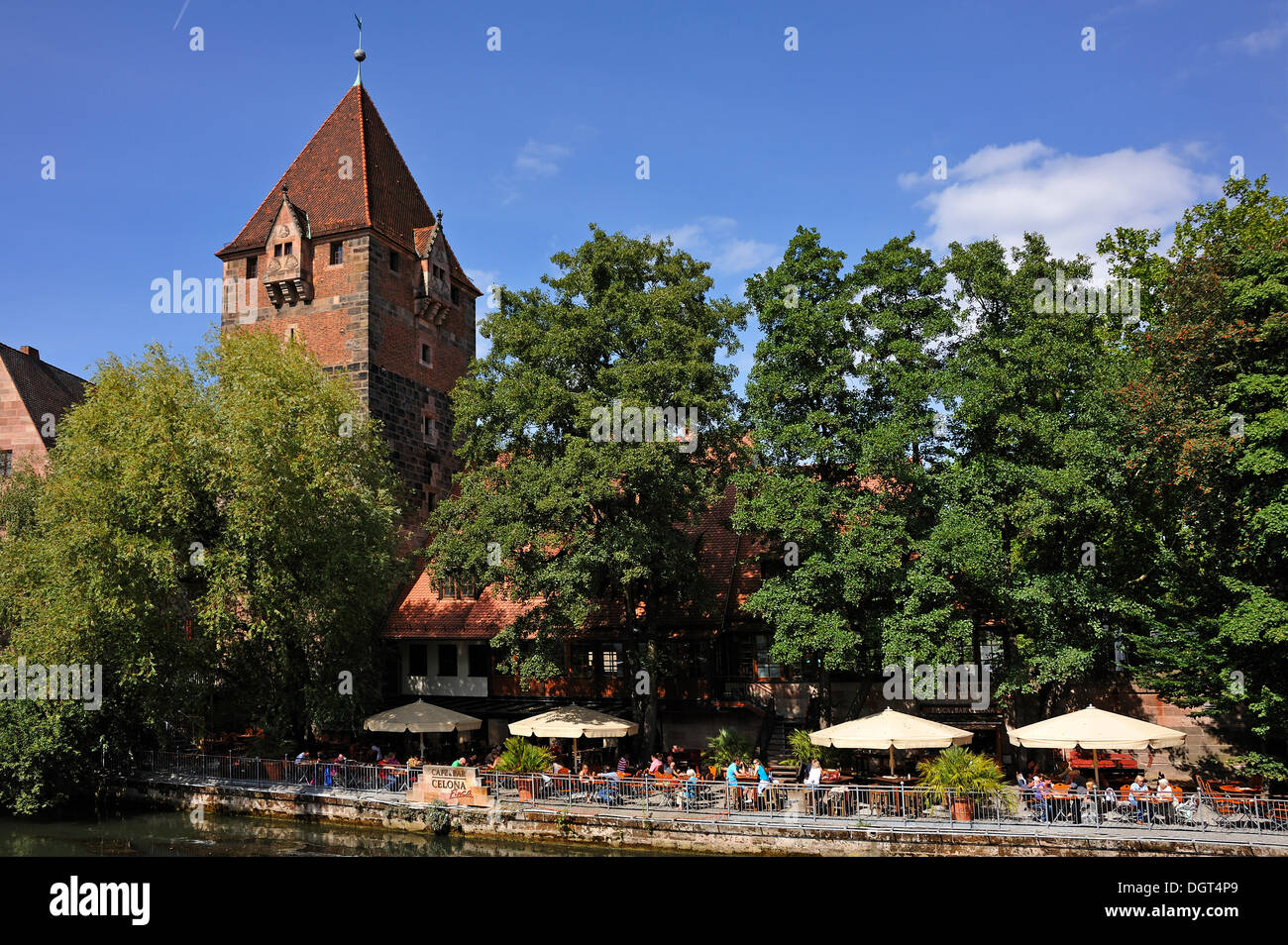 Schuldturm tower, a former debtors' prison, built in 1323 on the bank of the Pegnitz river, beer garden, Insel Schuett 2 Stock Photo