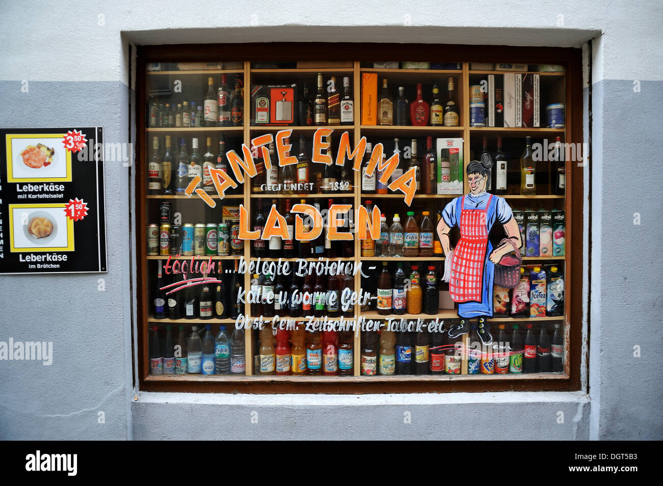 Shop window of a 'Tante Emma Laden', German for 'small corner shop', displaying bottles, historic center, Nuremberg Stock Photo