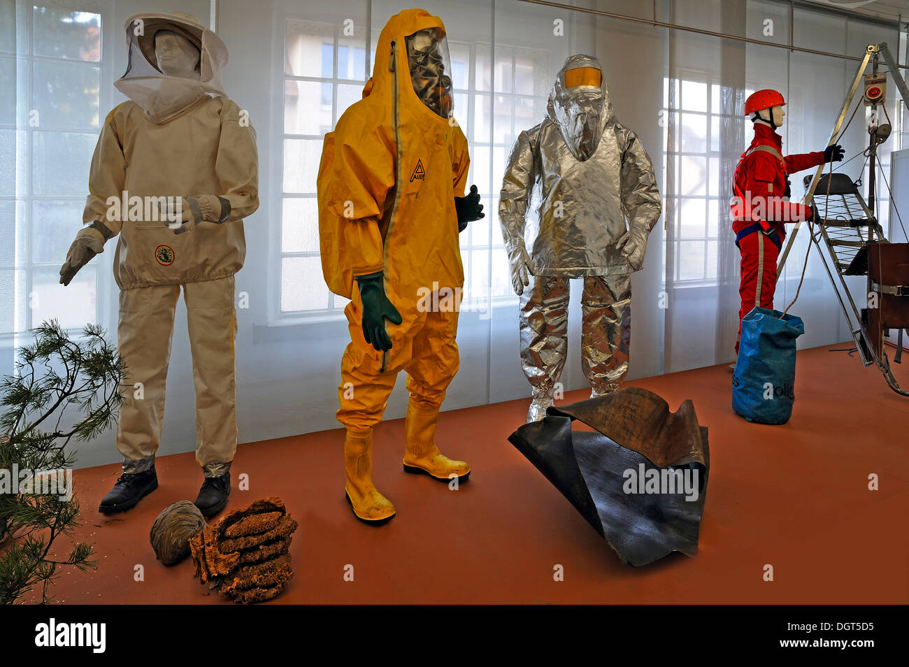 Various protective clothing for firefighters, an insect protective clothing, a chemical protective suit with a breathing mask, a Stock Photo