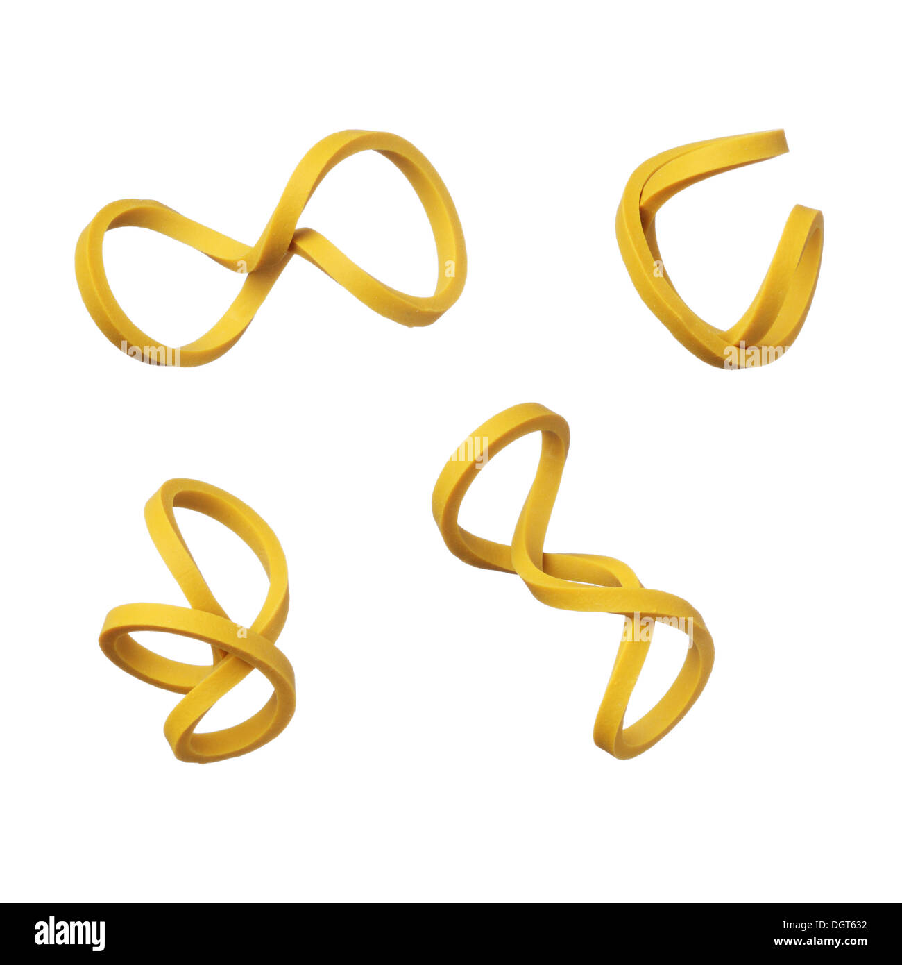 Twisted yellow elastic rubber bands isolated on white background Stock Photo