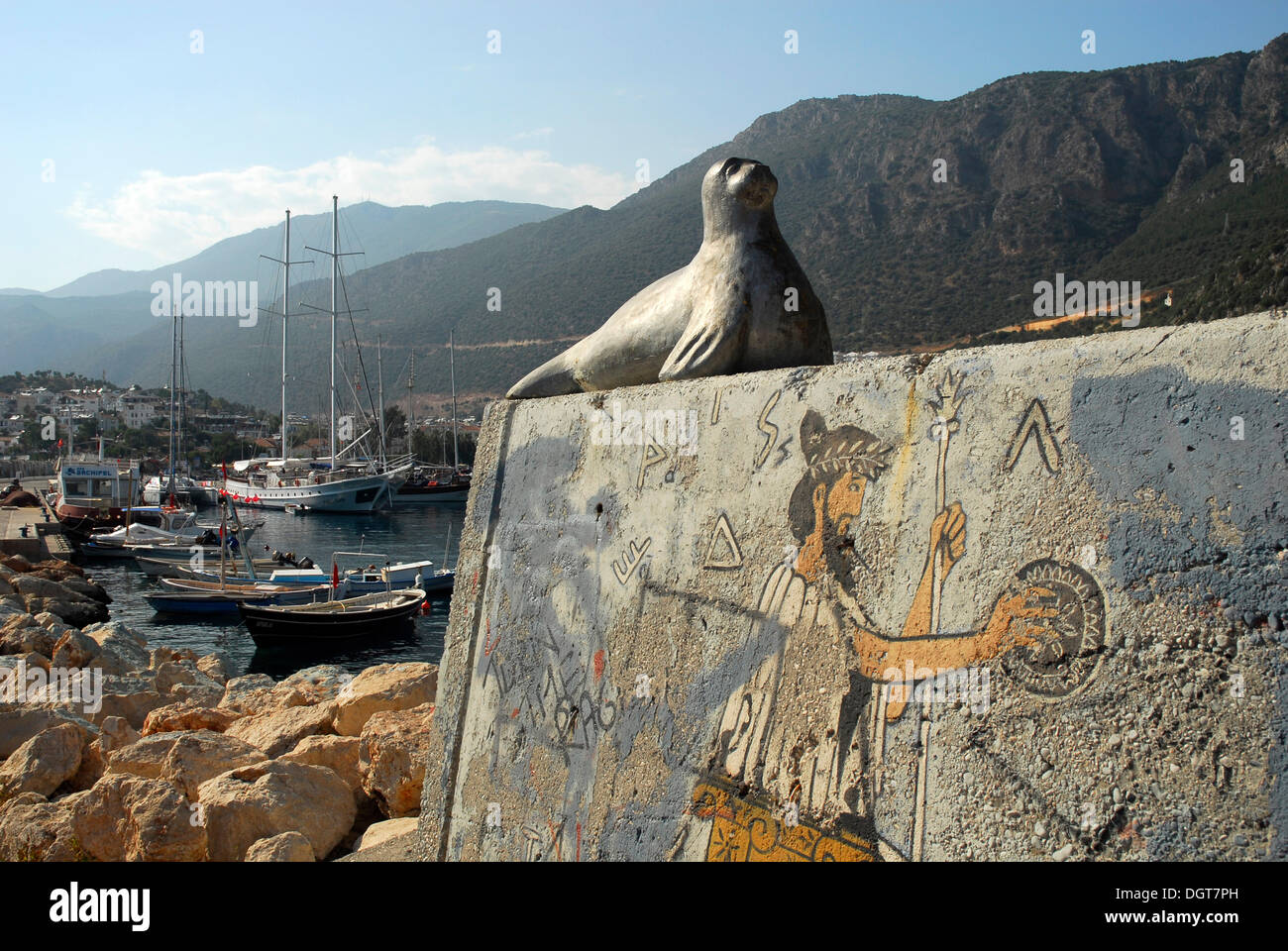 Seal, sculpture, wall painting in the port of Kas, Lycian coast, Antalya Province, Mediterranean, Turkey, Eurasia Stock Photo