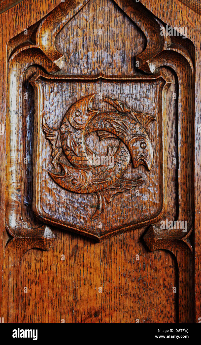 Detail of symbol of the Holy Trinity carved on a pew end in the parish church at Drayton, Norfolk, England, United Kingdom. Stock Photo