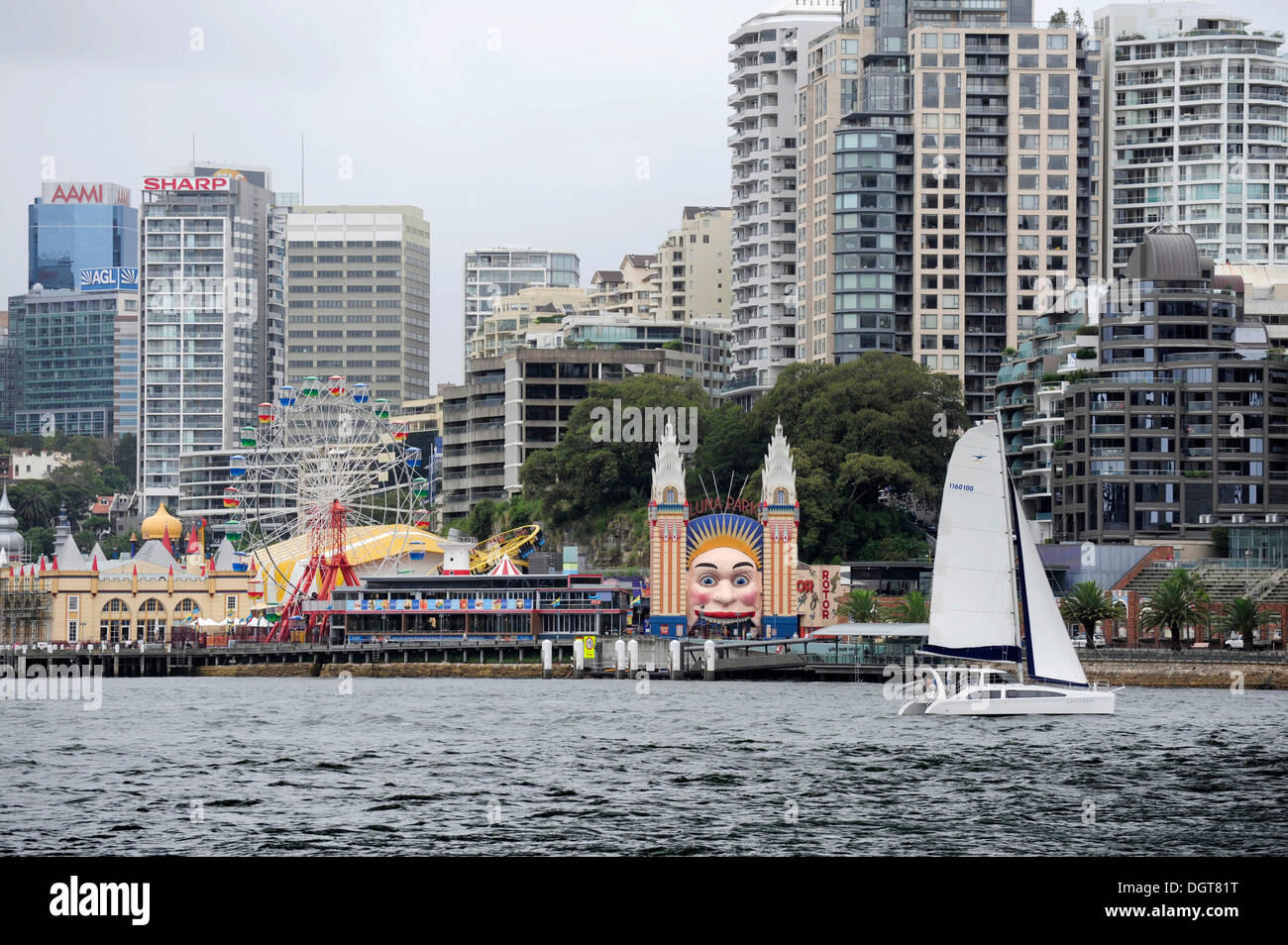 Sailing boat and Luna Park at Milsons Point, Sydney Harbour, North Sydney, New South Wales, NSW, Australia Stock Photo