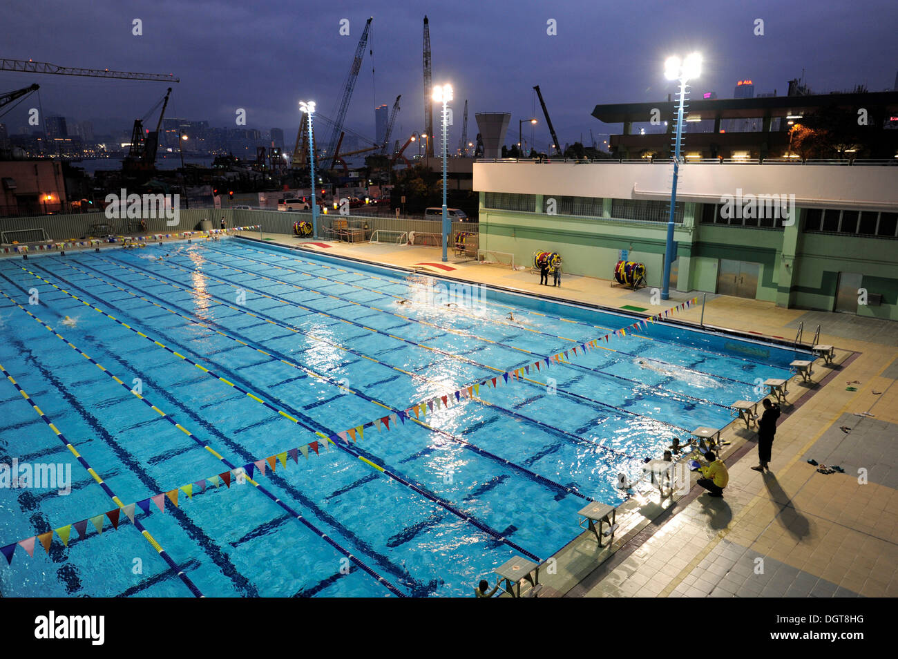 Victoria Harbour and swimming pool at dusk, Wan Chai, Hong Kong Island