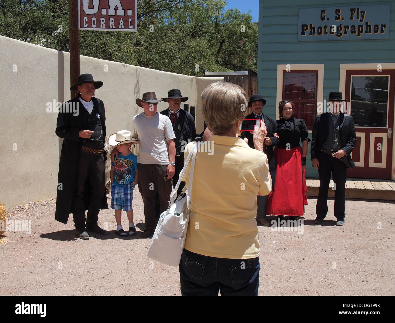 Tourist taking a snapshot of the actors and her family at the famous O.K. Corral in Tombstone, Arizona, USA Stock Photo