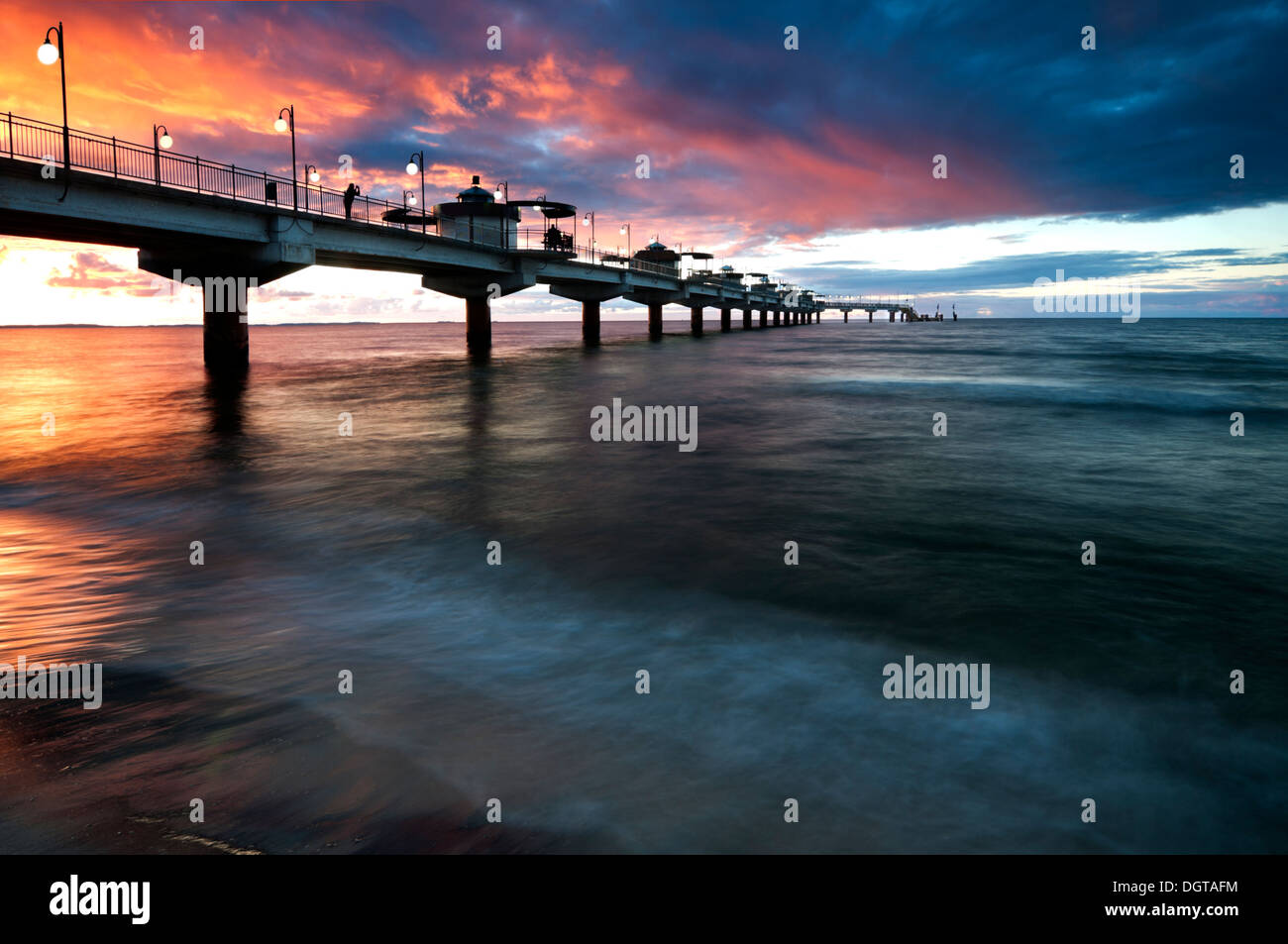 Sunset over Baltic Sea and pier in Miedzyzdroje, Poland, Europe Stock Photo