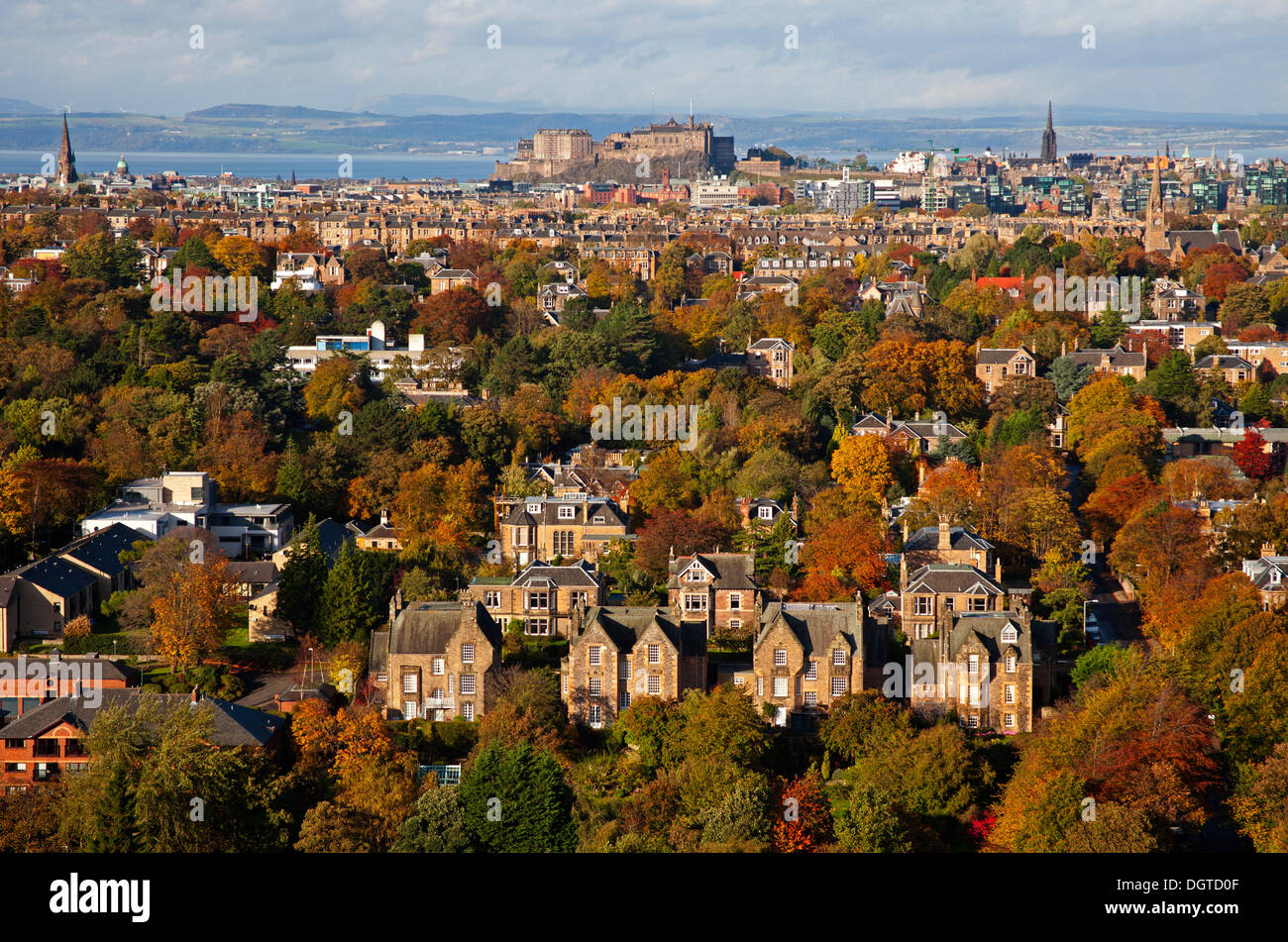 Edinburgh, Scotland, UK. 25th Oct, 2013. The sun picks out the Autumn colours on the decidious trees of the Scottish capital city. But forecasters are warning that more stormy weather is on its way. Stock Photo